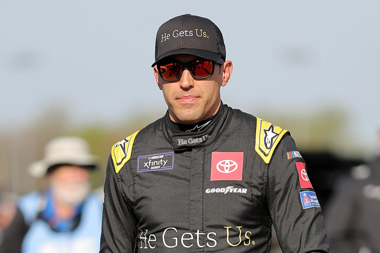 RICHMOND, VIRGINIA - MARCH 30: Aric Almirola, driver of the #20 He Gets Us Toyota, walks the grid during qualifying for the NASCAR Xfinity Series ToyotaCare 250 at Richmond Raceway on March 30, 2024 in Richmond, Virginia. (Photo by Jonathan Bachman/Getty Images)