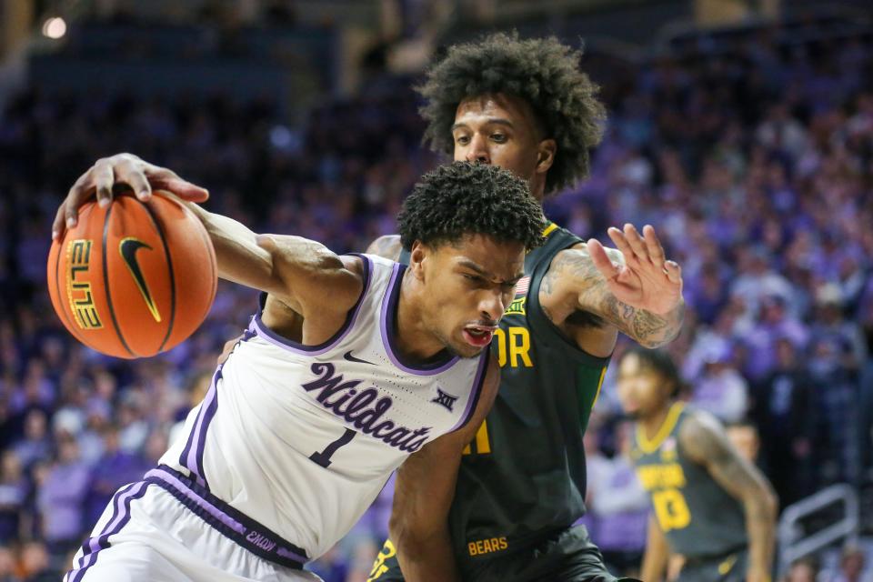 Kansas State forward David N'Guessan (1) works against Baylor's Jalen Bridges (11) during a Jan. 16 game at Bramlage Coliseum. N'Guessan announced Tuesday that he is returning for one more season with a Wildcats.