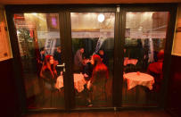 People gather and celebrate as bars, clubs and other establishments reopened in Poland after being closed for seven months, in Warsaw, Poland, Friday, May 14, 2021. (AP Photo/Czarek Sokolowski)