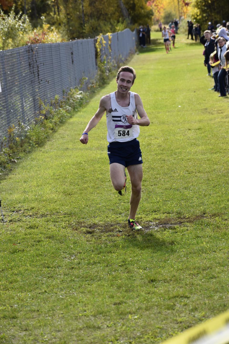 Colts boys cross country runner Thomas Holm runs his way to a Class D championship.