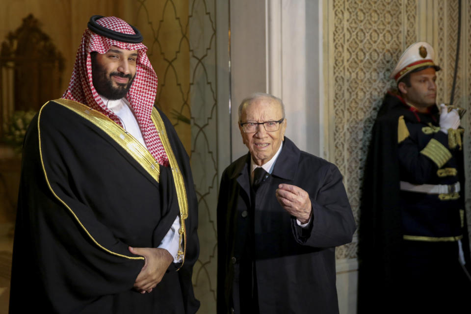 Tunisian President Beji Caid Essebsi, right, greets Saudi Crown Prince Mohammed bin Salman upon his arrival at the presidential palace in Carthage near Tunis, Tunisia, Tuesday, Nov. 27, 2018. Traveling abroad for the first time since the killing of Saudi journalist Jamal Khashoggi, the crown prince is visiting allies in the Middle East before heading to a G20 summit in Argentina later this week. (AP Photo/Hassene Dridi)