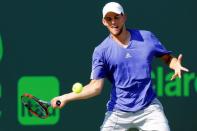 Apr 1, 2015; Key Biscayne, FL, USA; Dominic Thiem hits a forehand against Andy Murray (not pictured) on day ten of the Miami Open at Crandon Park Tennis Center. Murray won 3-6, 6-4, 6-1. Mandatory Credit: Geoff Burke-USA TODAY Sports