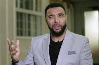 Former Premier League player Troy Deeney speaks during an interview in London, Thursday, March 21, 2024. Racism has long permeated the world’s most popular sport, with soccer players subjected to racist chants and taunts online. While governing bodies like FIFA and UEFA have taken steps to combat the abuse of players, the lack of diversity in the upper ranks at major clubs remains an unsolved problem. Deeney was hired as head coach of fourth tier Forest Green Rovers in December, but was fired less than a month later. (AP Photo/Kin Cheung)