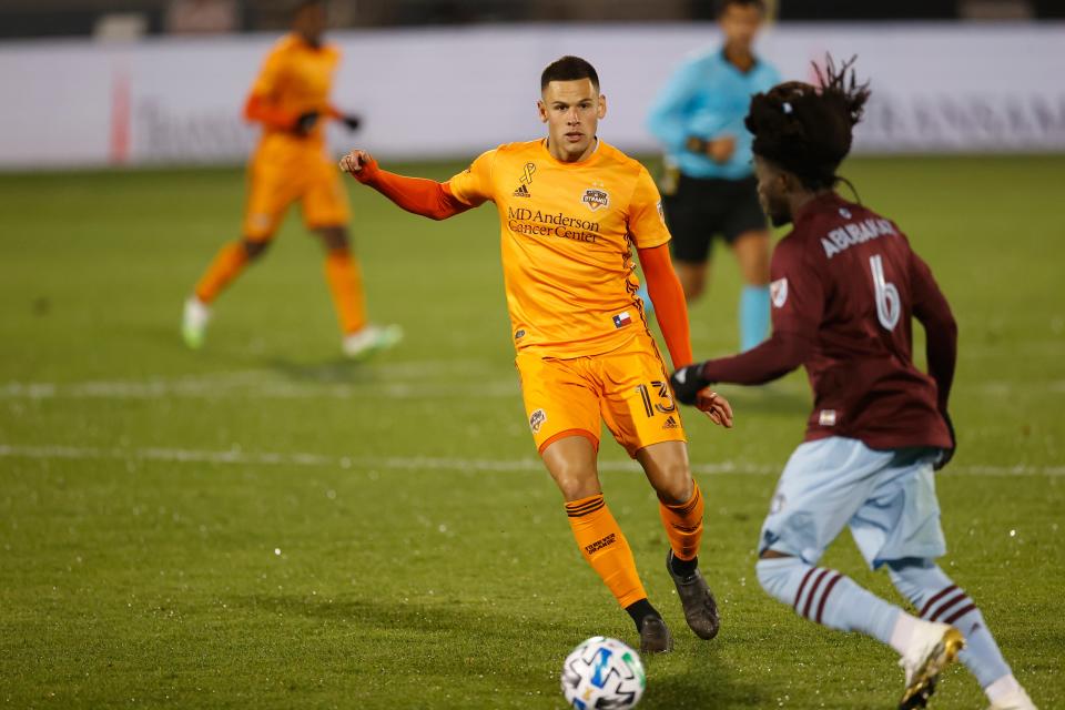 Houston Dynamo forward Christian Ramirez (13) in the second half of an MLS soccer match Wednesday, Sept. 9, 2020, in Commerce City, Colo. The match ended in a 1-1 tie. (AP Photo/David Zalubowski)