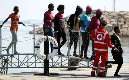 Migrants disembark from the Italian Navy vessel Sfinge in the Sicilian harbour of Pozzallo, southern Italy, August 31, 2016. REUTERS/ Antonio Parrinello