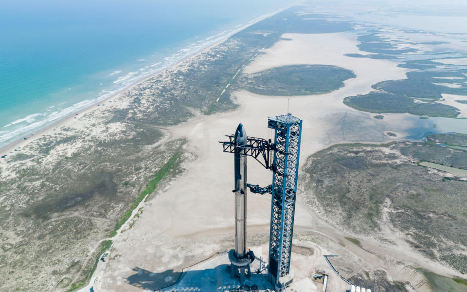 SpaceX's Starship SN24 and Super Heavy booster stand atop their launch pad at Starbase in Boca Chica, Texas ahead of an April 2023 test flight.