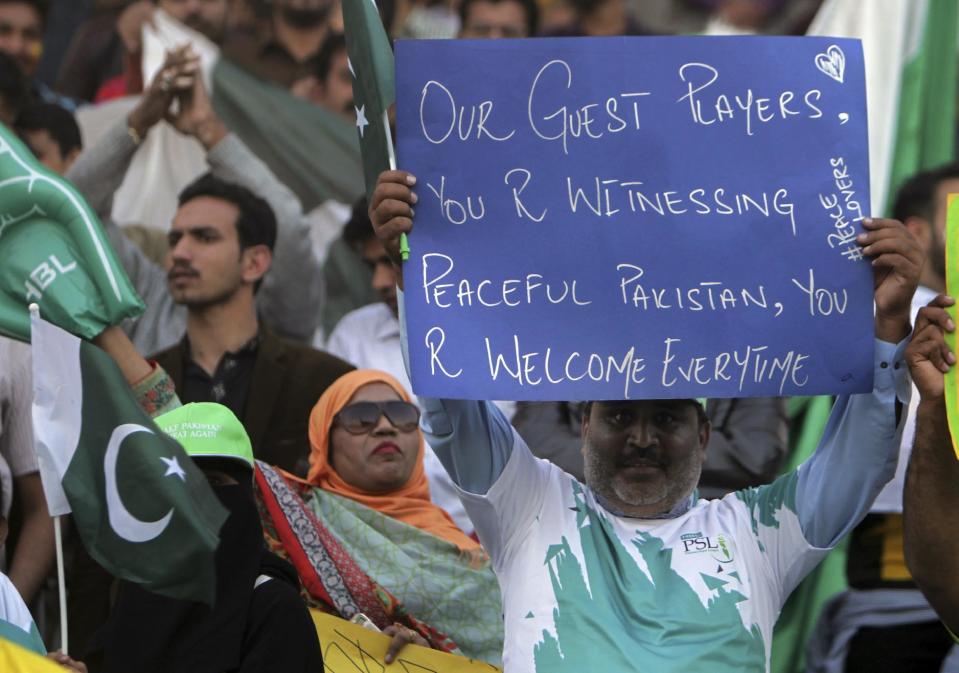 Pakistani cricket fans celebrate the final of Pakistan Sports League at the Gaddafi Stadium, in Lahore, Pakistan, Sunday, March 5, 2017. West Indies World Twenty20 winning captain Darren Sammy was among nine foreign cricketers to arrive in Lahore early Sunday as extraordinary security measures were put in place around Gaddafi Stadium to ensure a peaceful Pakistan Super League final. (AP Photo/K.M. Chaudary)