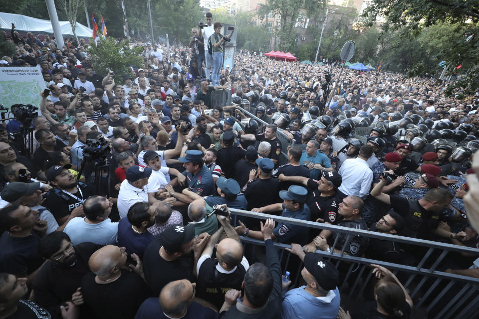 CORRECTS BYLINE - Police blocked the way to protesters during a rally against Prime Minister Nikol Pashinyan in Yerevan, Armenia, Wednesday, June 12, 2024. (Vahram Baghdasaryan/Photolure via AP)