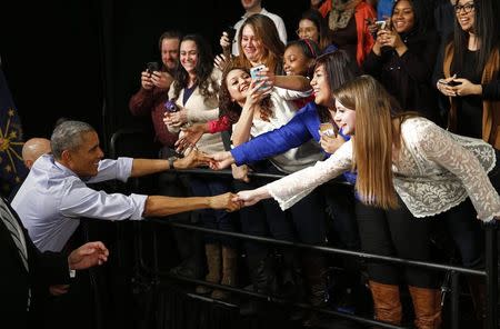 U.S. President Barack Obama shakes hands with students after speaking about his plan for free community college education and middle class economics during a visit Ivy Tech Community College in Indianapolis, Indiana, February 6, 2015. REUTERS/Kevin Lamarque