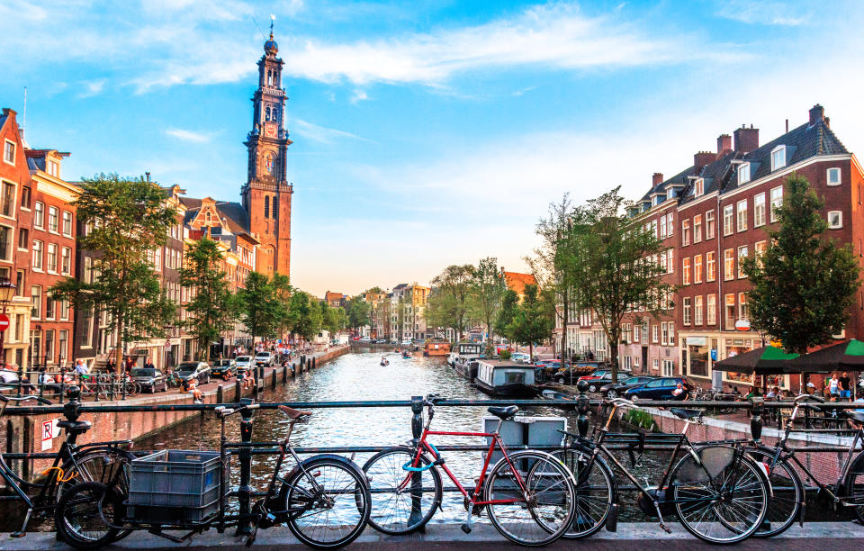 View of canal in Amsterdam, Holland.
Amstel river, canal, and bicycles.