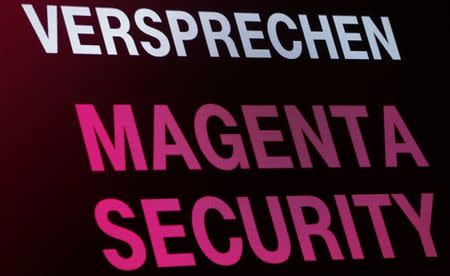 A screen displays "Promise, Magenta Security" at a Deutsche Telekom "Security in Magenta" congress in Frankfurt, Germany on November 29, 2016. REUTERS/Ralph Orlowski