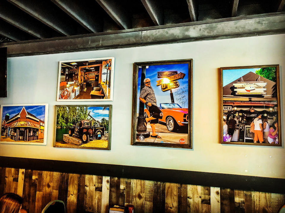 Photos, including a signed picture from Guy Fieri, hang on the wall at DJ's Clam Shack (Credit: Anthony Gentile)