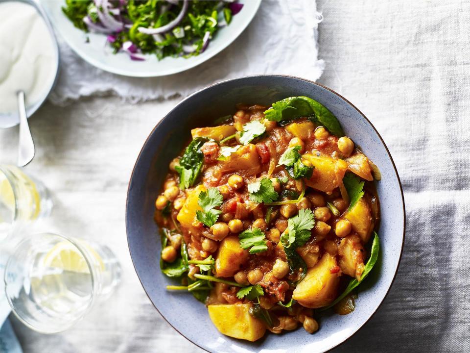 Indian-inspired potato and chickpea masala curryThis chickpea curry recipe puts the potato under the flavoursome influence of Indian spices, including masala, and other fragrant ingredients such as ginger, coconut milk and tomatoes.The combination of smooth potatoes and chickpeas offer a fulfilling base to this curry recipe and acts as a great alternative to meat-based curries.900g smooth potatoes (such as Desiree), peeled and cubed 1 tin of chickpeas, drained 3 tbsp masala curry paste 1 tbsp garam masala​ 2 onions, sliced 1 tbsp sunflower oil 2 cloves of garlic 1 tbsp fresh grated ginger 1 tin of chopped tomatoes 1 tin of reduced fat coconut milk 1 bag of baby spinach 1 tbsp fresh chopped corianderIn a large pan or casserole pot, gently cook the onion for five minutes in the sunflower oil. Next add the garlic, ginger, garam masala and curry paste, and continue cooking for three minutes over a medium heat.Now add the potatoes and chickpeas and give them a stir in the lovely spices, making sure everything is coated. Pour in the tinned tomatoes and coconut milk and bring to a steady simmer. At this stage, add a little salt and milled pepper.Continue cooking until the potatoes are soft. If the sauce feels a little dry, add a little water.Just before serving, stir in the spinach and coriander and serve with yoghurt. Recipe from lovepotatoes.co.uk