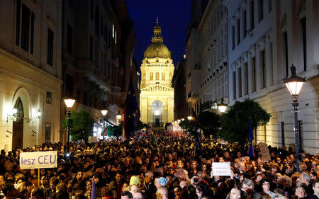 People attend a rally outside George Soros's Central European University to protest against the university being forced out of Budapest by Prime Minister Viktor Orban's government in Budapest, Hungary, October 26, 2018. REUTERS/Bernadett Szabo