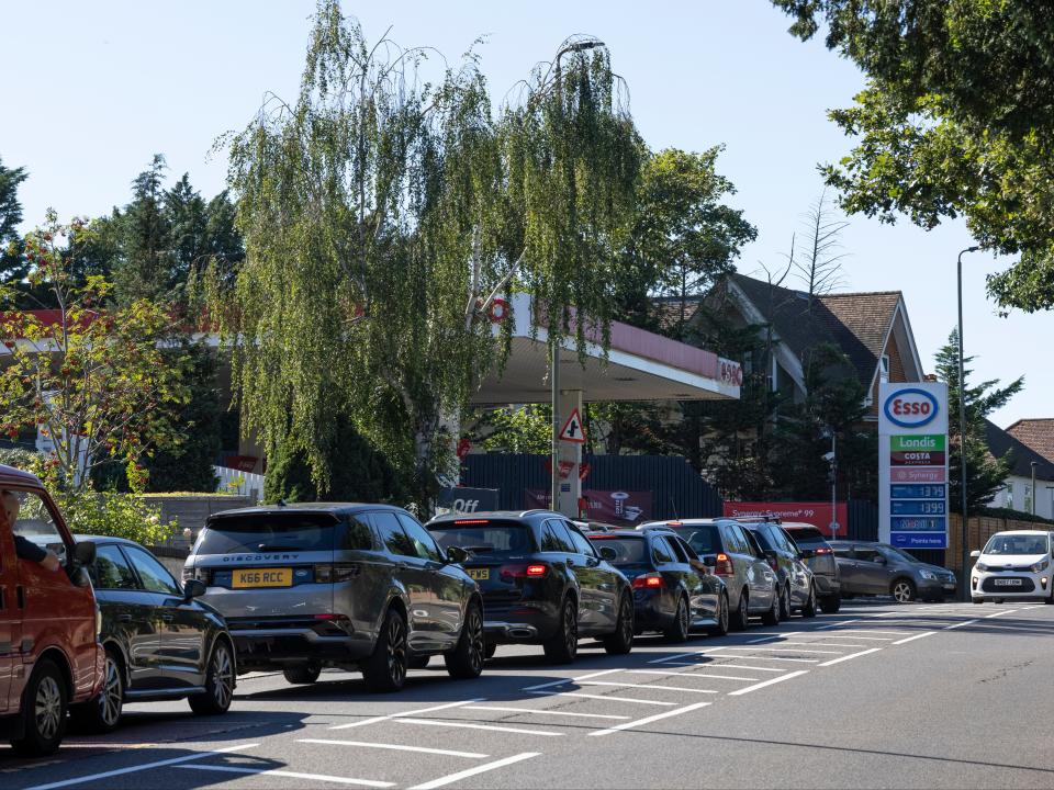 A queue forms for an Esso petrol station in London (Getty)