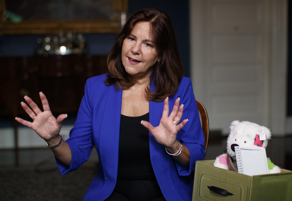 Karen Pence sits next to a Comfort Crew Kit to be given to a military child during an interview with The Associated Press at the Vice President's residence, the Naval Observatory, in Washington, Monday, Sept. 10, 2018. Being married to the vice president has its privileges. “Now people take my phone calls,” Karen Pence told The Associated Press in an interview. These days, Vice President Mike Pence’s wife is using her new cachet to call around on behalf of military spouses, looking to help them overcome the challenges that come with being wed to an active-duty service member.(AP Photo/Carolyn Kaster)