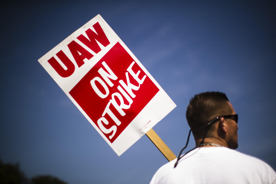 A worker pickets outside a General Motors facility in Langhorne, Pa., Monday, Sept. 23, 2019. The strike against General Motors by 49,000 United Auto Workers entered its second week Monday with progress reported in negotiations but no clear end in sight. (AP Photo/Matt Rourke)