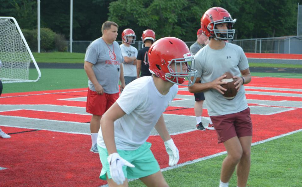 Juniors Blake Rickner (Front) and Drew Logsdon run a drill for Bedford during practice.