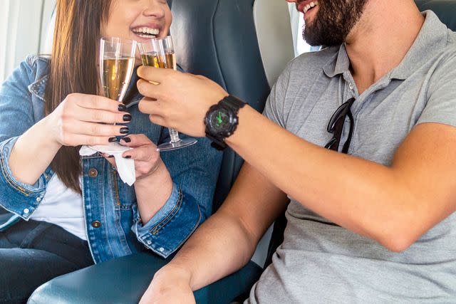 <p>wsfurlan/Getty</p> A couple on an airplane (stock image)