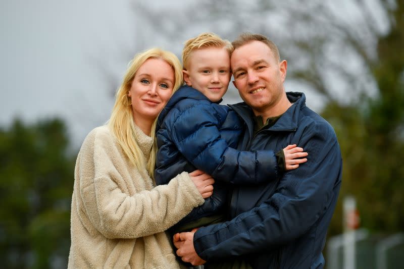 Tom Hayes, his wife Sarah Tighe and son Josh pose for a picture, in Arundel