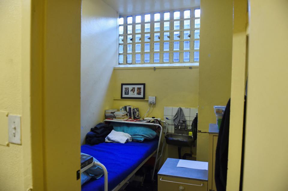 Religious and self help books can be seen stacked above Pistorius’s bed (Supplied)