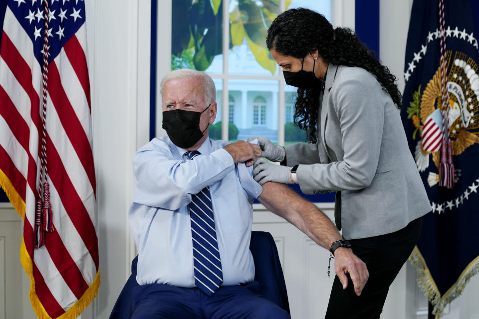 President Joe Biden receives a COVID-19 booster shot during an event in the South Court Auditorium on the White House campus, Monday, Sept. 27, 2021, in Washington. (AP Photo/Evan Vucci)