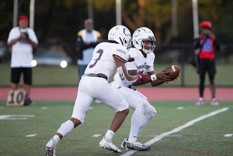 East Orange Campus football at Clifton on Thursday, Sept. 1, 2022. C #1 QB Romelo Tables hands the ball to #3 Devon Stroble. 