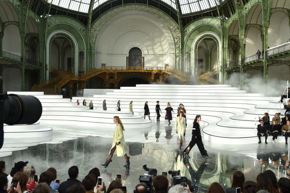 <p>Continuing her stream of more understated show sets, creative director Virginie Viard transformed the Grand Palais into a minimalist map. A more graphic take on the environmental theme that has run throughout fashion month, Viard had guests sit on swirling white benches that, from an aerial view, revealed themselves to be ordnance survey lines that you would find on a geographical map.</p>