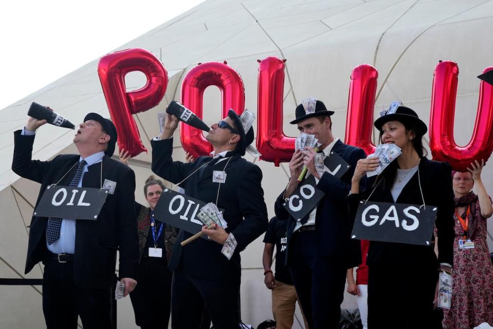 Activists protest against fossil fuels at the COP28 U.N. Climate Summit, Sunday, Dec. 10, 2023, in Dubai, United Arab Emirates. (AP Photo/Rafiq Maqbool)