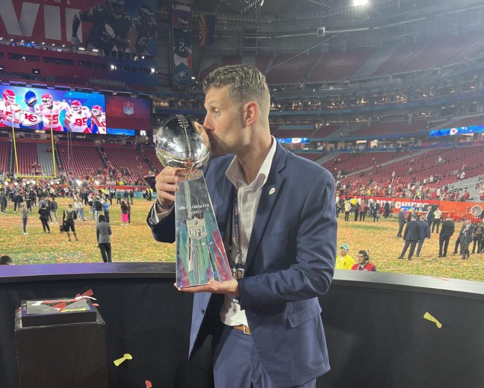 Green Bay East graduate Cassidy Kaminski, a scout for the Kansas City Chiefs, kisses the Lombardi Trophy after the Chiefs' 38-35 win over the Philadelphia Eagles earlier this month.