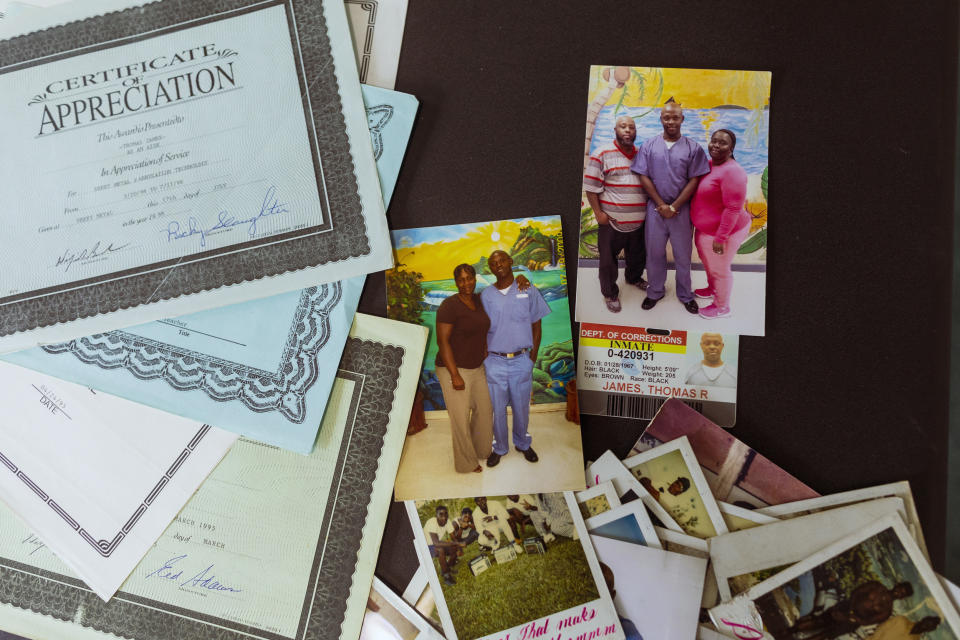 Image: Diplomas and photographs of family members visiting Thomas Raynard James while in prison. (Saul Martinez for NBC News)