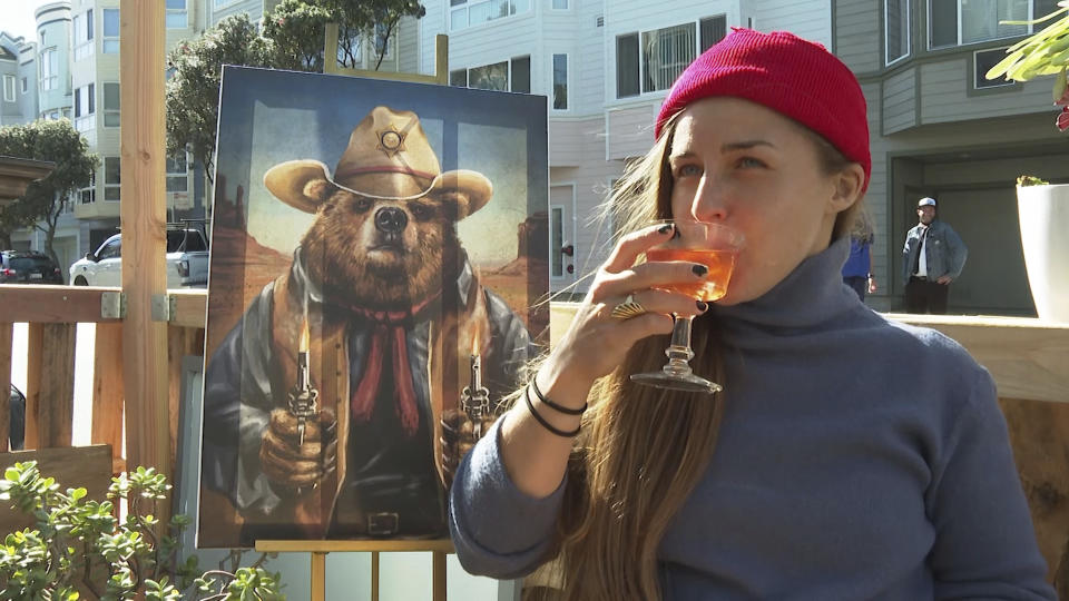 In this Feb. 12, 2021 photo, a customer drinks an alcohol-free cocktail at San Francisco's zero-proof bar Ocean Beach Cafe. According to IWSR Drinks Market Analysis, global consumption of zero-proof beer, wine and spirits is growing two to three times faster than overall alcohol consumption. (AP Photo/Haven Daley)