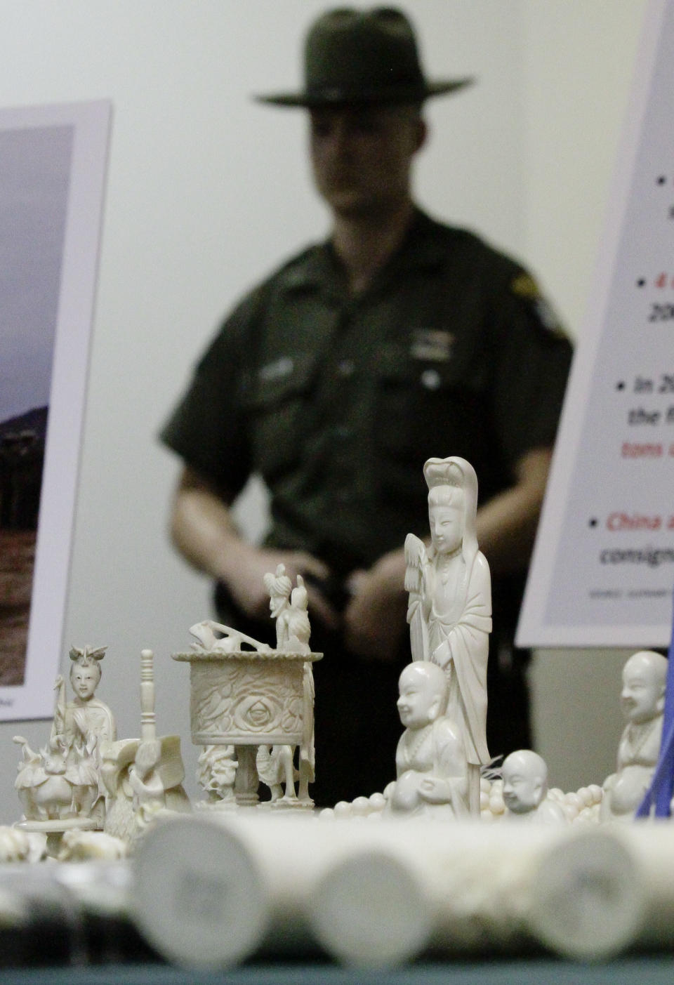 Jewelry and carvings are displayed during a press conference where Manhattan District Attorney Cyrus R. Vance, Jr., announced the guilty pleas of two ivory dealers and their businesses for selling and offering for sale illegal elephant ivory with a retail value of more than $2 million on Thursday, July 12, 2012. (AP Photo/Bebeto Matthews)