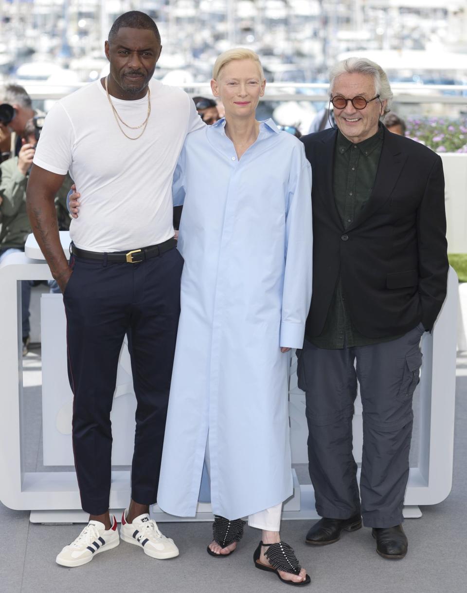 <p>Idris Elba, Tilda Swinton, and<em> Three Thousand Years Of Longing</em> director George Miller pose together at the 2022 Cannes Film Festival in France on May 21.</p>