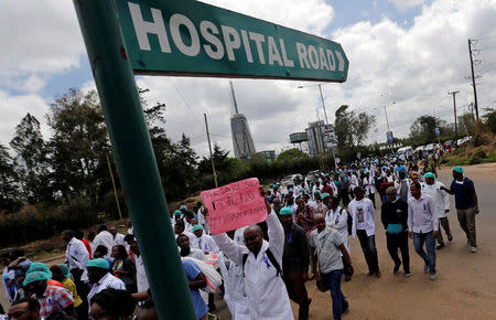 Kenyan doctors march during a strike to demand fulfilment of a 2013 agreement between their union and the government that would raise their pay and improve working conditions in Nairobi, Kenya December 5, 2016. REUTERS/Thomas Mukoya