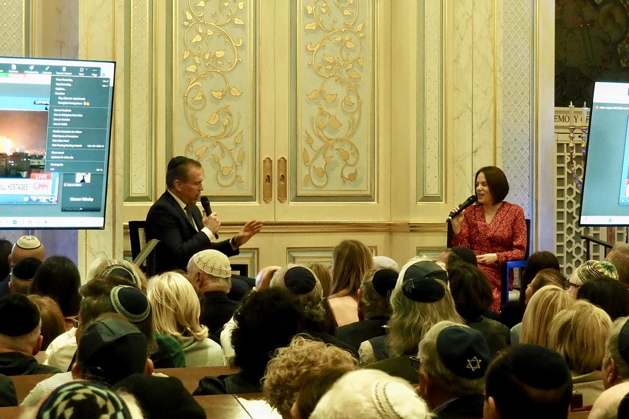 Gilad Erdan, Israel's amabassador to the United Nations, and moderator Rivka Kidron discuss the Israel-Hamas war Wednesday at Palm Beach Synagogue.