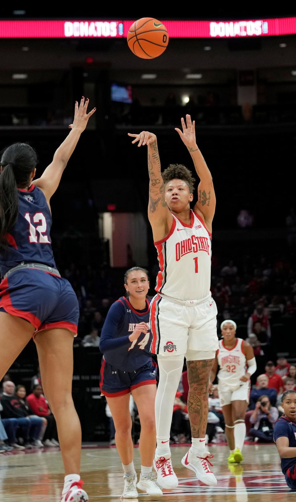 Ohio State guard Rikki Harris (1) makes a 3-point shot at the halftime buzzer on Friday.