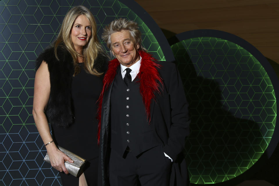 Penny Lancaster and Rod Stewart pose for photographers upon arrival at the Bloomberg and Vanity Fair Gala Dinner in central London, Tuesday, Dec. 11, 2018. (Photo by Joel C Ryan/Invision/AP)