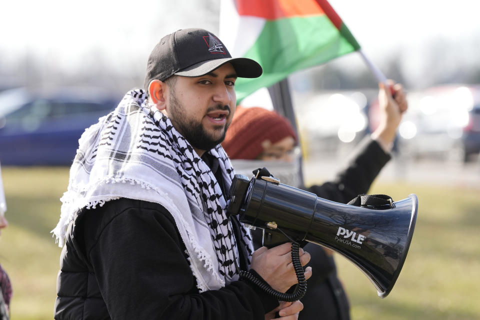 Community activist Adam Abusalah joins about three dozen people protesting Israel's attacks in Gaza, Thursday, Feb. 8, 2024 in Dearborn, Mich. The protesters gathered hoping to be heard by members of the Biden White House who were scheduled to meet in suburban Detroit with Muslim and Arab American leaders. (AP Photo/Carlos Osorio)