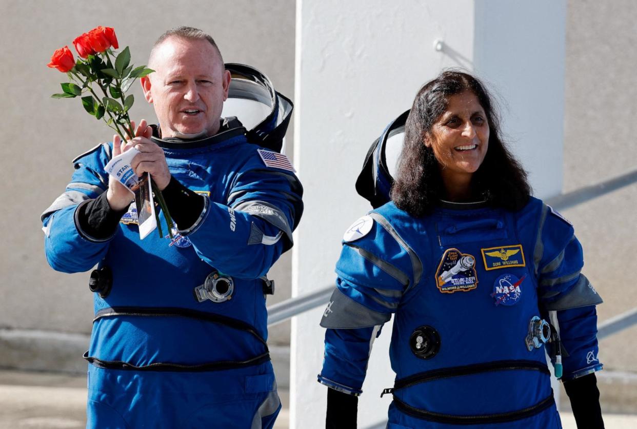 PHOTO: NASA astronauts Butch Wilmore and Suni Williams walk at NASA's Kennedy Space Center, on the day of Boeing's Starliner-1 Crew Flight Test (CFT) mission, in Cape Canaveral, Florida, on June 1, 2024.  (Joe Skipper/Reuters)