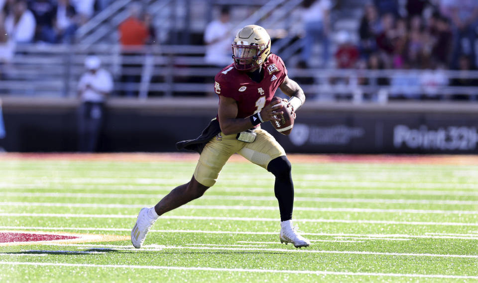 Boston College quarterback Thomas Castellanos (1) rolls out during the second half of an NCAA college football game against UConn Saturday, Oct. 28, 2023 in Boston. (AP Photo/Mark Stockwell)