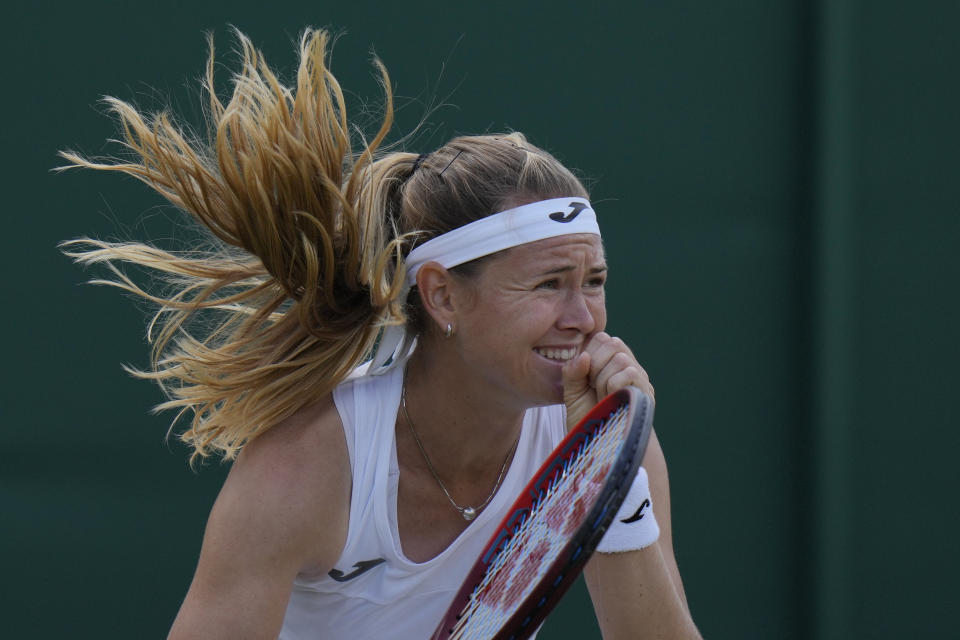 Marie Bouzkova of the Czech Republic celebrates defeating France's Caroline Garcia in a fourth round women's singles match on day seven of the Wimbledon tennis championships in London, Sunday July 3, 2022. (AP Photo/Alastair Grant)