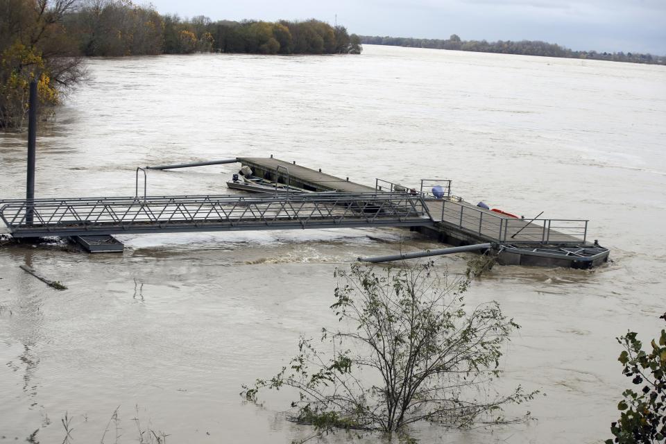 The swollen Po river in Sannazzaro, near Pavia, northern Italy, Sunday, Nov. 24, 2019. Rain-swollen rivers and flooded streets plagued Italy, where it has been raining, sometimes heavily, in much of the country nearly every day for about two weeks. (AP Photo/Luca Bruno)