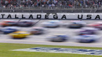 Cars move during a NASCAR Cup Series auto race at Talladega Superspeedway, Sunday, April 21, 2024, in Talladega. Ala. (AP Photo/Butch Dill)