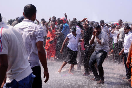 Demonstrators react during a clash with police during a protest against the launching of a Chinese industrial zone by China Merchants Port Holdings Company, in Mirijjawila, Sri Lanka January 7, 2017. REUTERS/Stringer