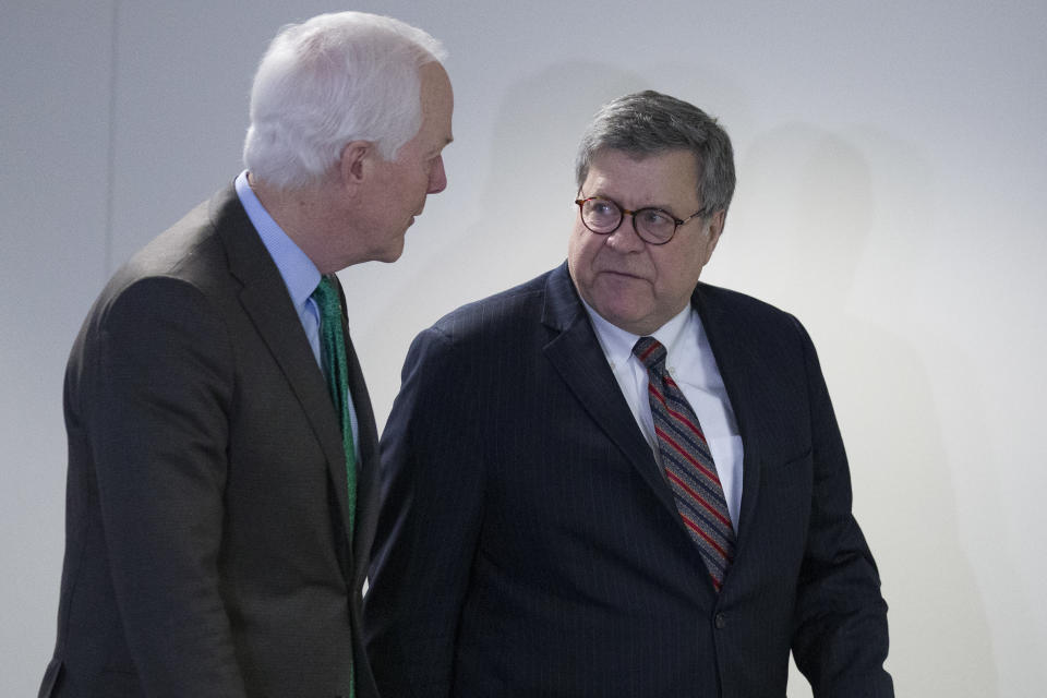 Sen. John Cornyn, R-Texas, left, walks with Attorney General nominee William Barr after their meeting on Capitol Hill, Wednesday, Jan. 9, 2019 in Washington. (AP Photo/Alex Brandon)