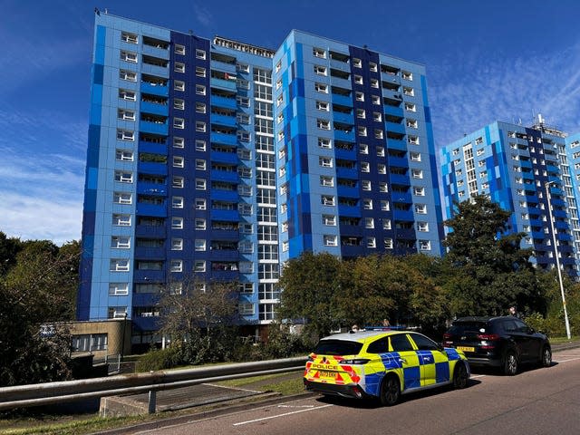 A police car outside a block of flats