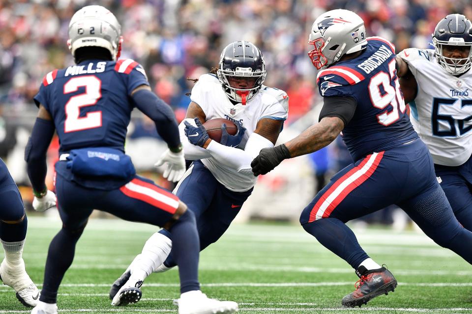 Titans running back D'Onta Foreman churns through the Patriots' defense during Week 12. Both Foreman and fellow running back Dontrell Hilliard should be added to fantasy rosters. It's not completely clear which will lead the team in touches, but Foreman had 19 carries the last time out.