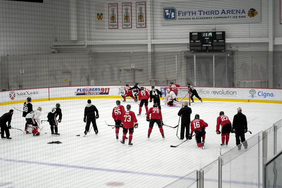 The Chicago Blackhawks begin their 2021 training camp during an NHL hockey practice Monday, Jan. 4, 2021, in Chicago. (AP Photo/Charles Rex Arbogast)