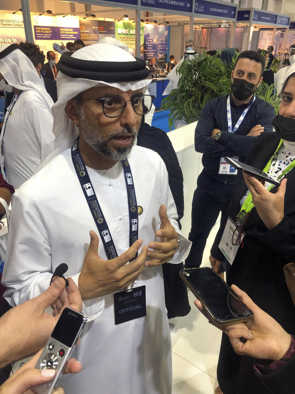 United Arab Emirates Energy Minister Suhail al-Mazrouei speaks to journalists at the Abu Dhabi International Petroleum Exhibition and Conference, in Abu Dhabi, United Arab Emirates, Monday Nov. 15, 2021. Energy ministers from across the developing world at the conference stressed the need for continued investment in fossil fuel production just days after these same nations joined around 200 countries in accepting a compromise deal aimed at limiting rising global temperatures and curbing greenhouse emissions. (AP Photo/Aya Batrawy)